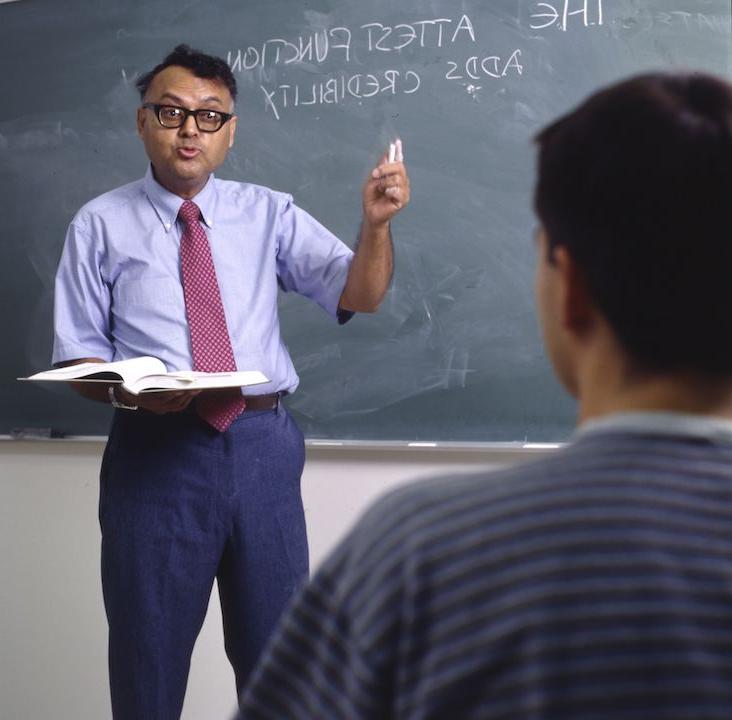 Professor teaching student